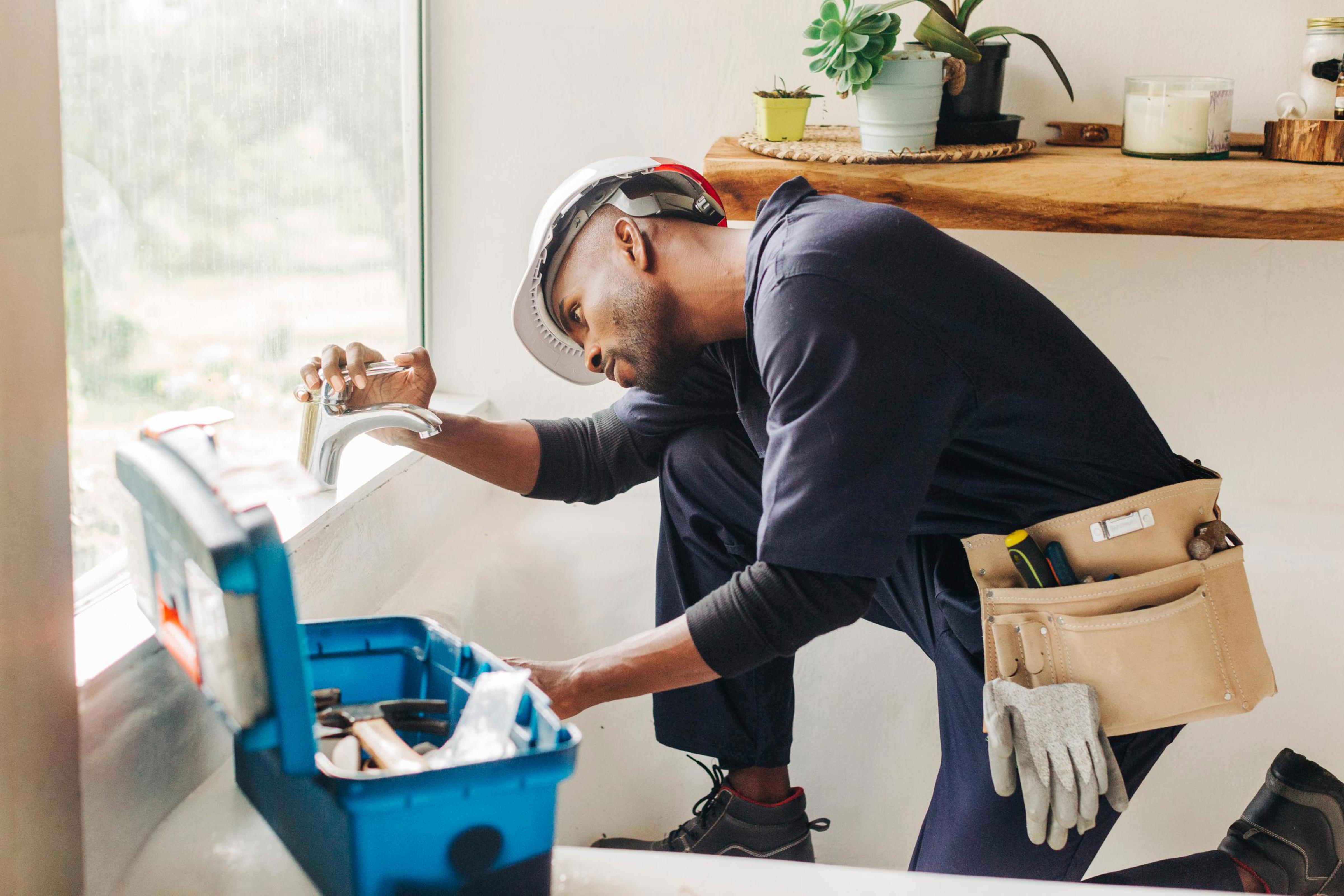 man working on sink_Drees